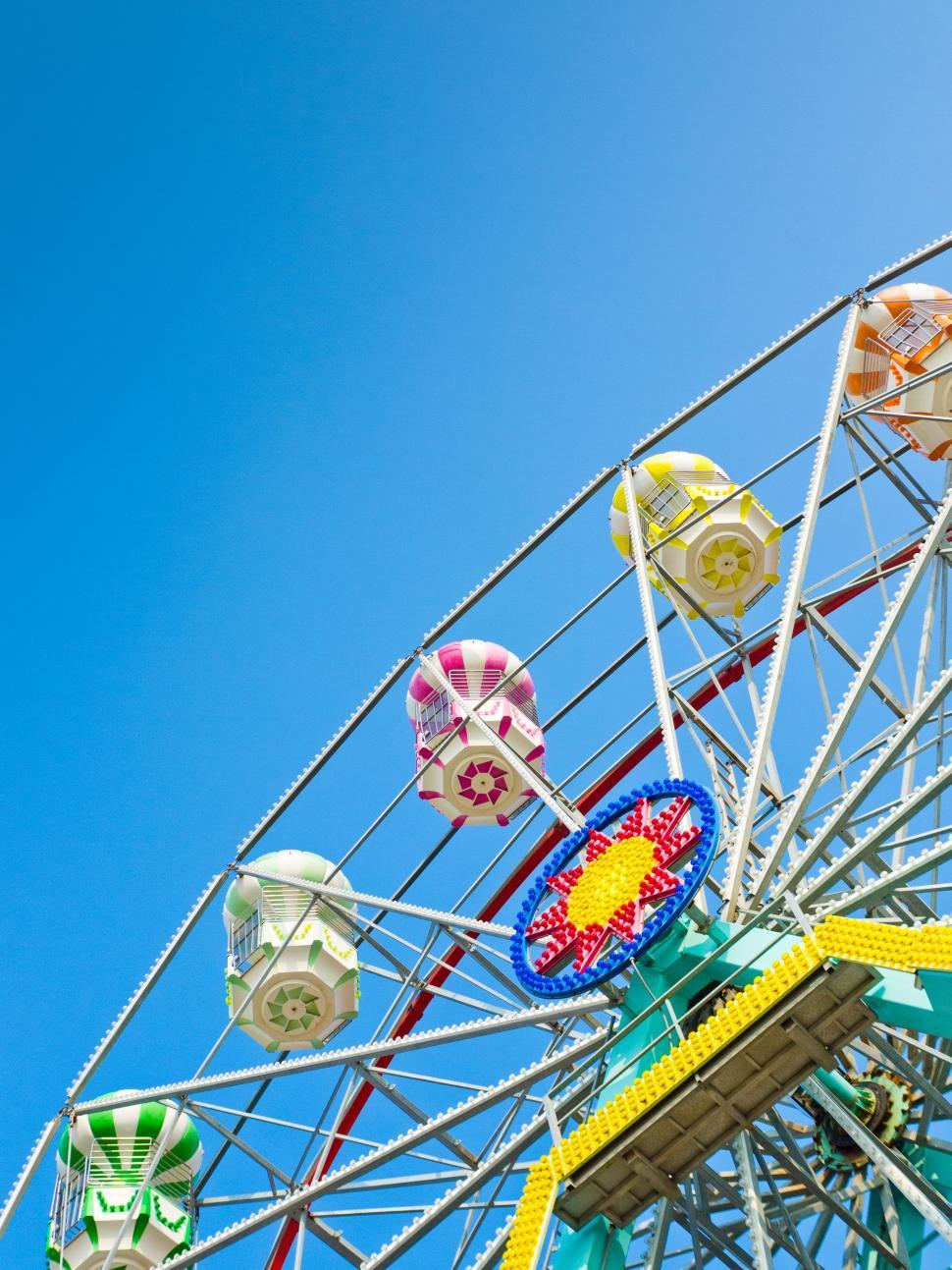 Free Image of Ferris Wheel Against Blue Sky 