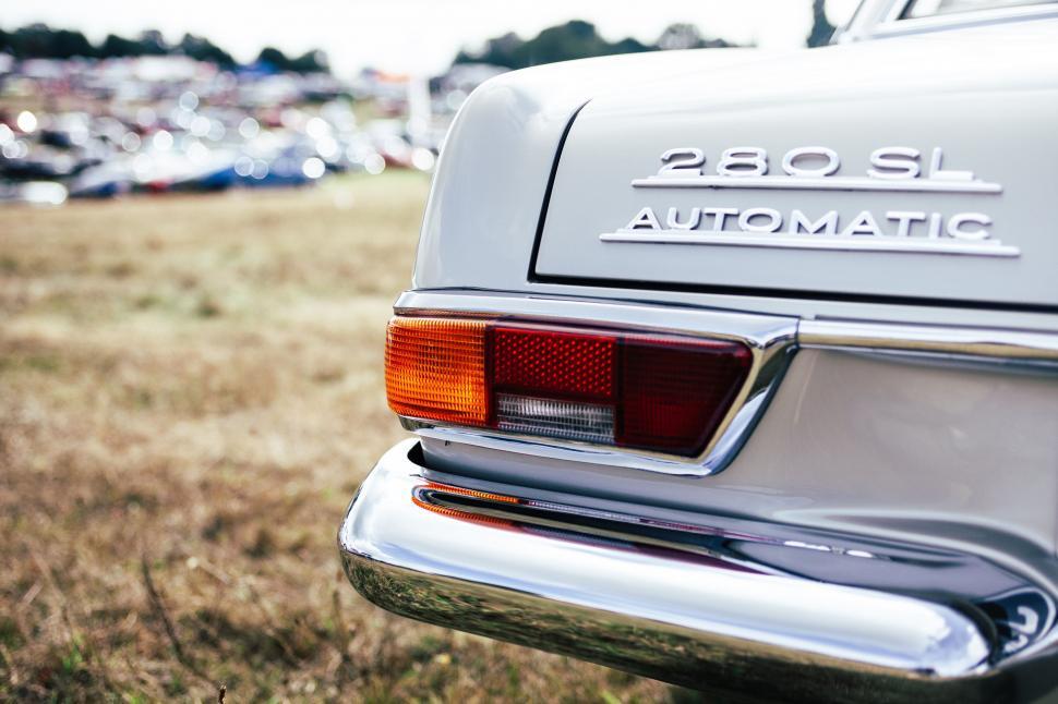 Free Image of Close-Up of a Car Parked in a Field 
