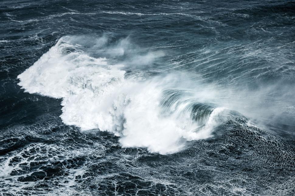 Free Image of A Wave Crashing in the Ocean 
