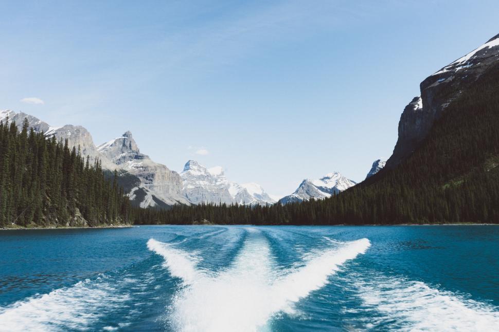 Free Image of Boat Wake Cutting Through Lake Waters 