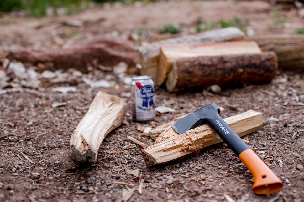 Free Image of Hammer and Can of Beer on the Ground 