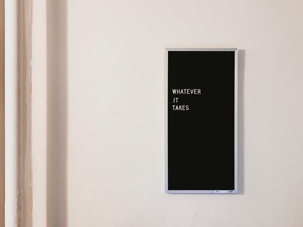 Free Image of Black and White Picture Hanging on a Wall 