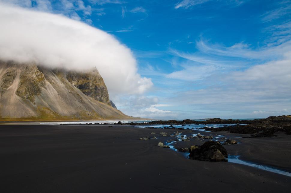 Free Image of Majestic Mountain Shrouded in Cloud by Waters Edge 