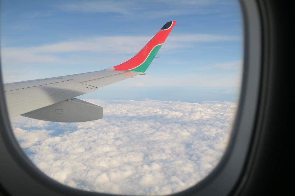 Free Image of A View of the Wing of an Airplane in the Sky 