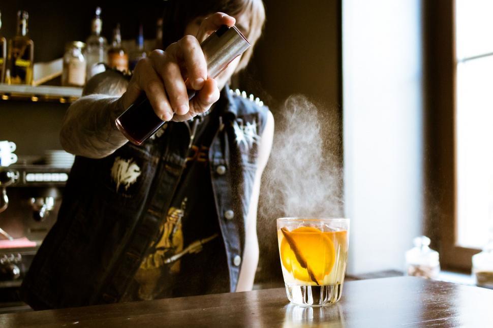 Free Image of Person Pouring Drink Into Glass 