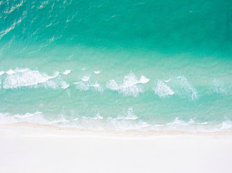Free Image of Person Riding Surfboard on Ocean Wave 