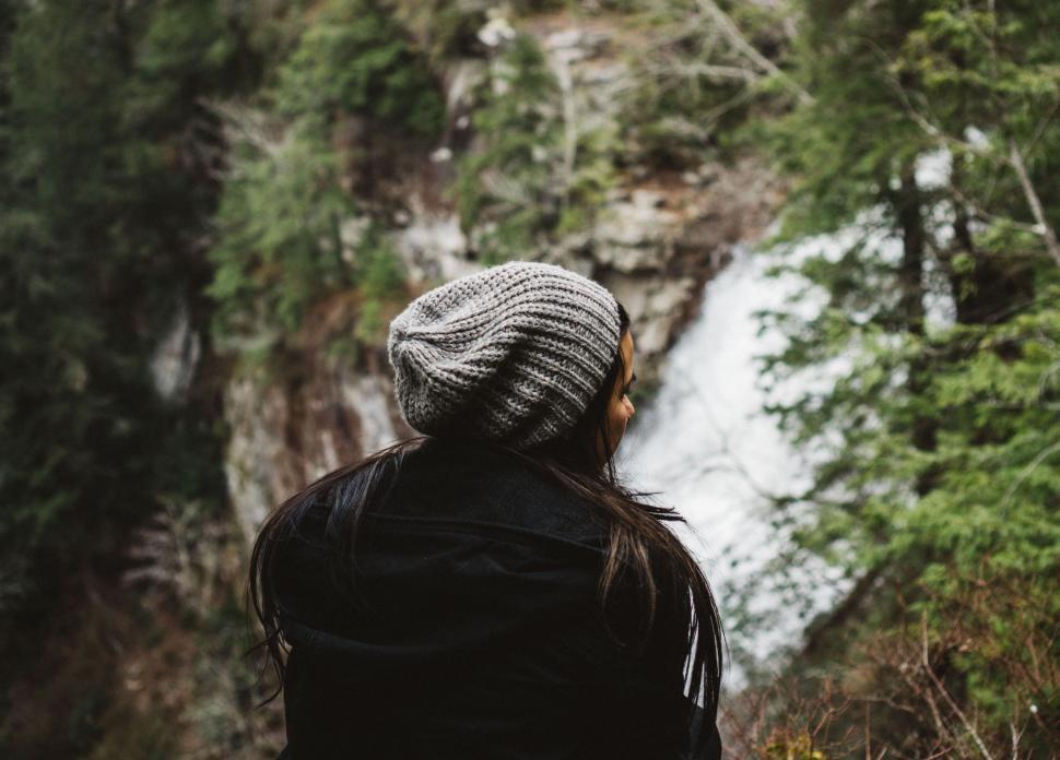 Free Image of Person Standing in Front of Waterfall 