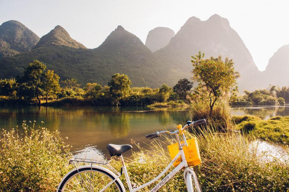 Free Image of White Bike Parked Next to River 