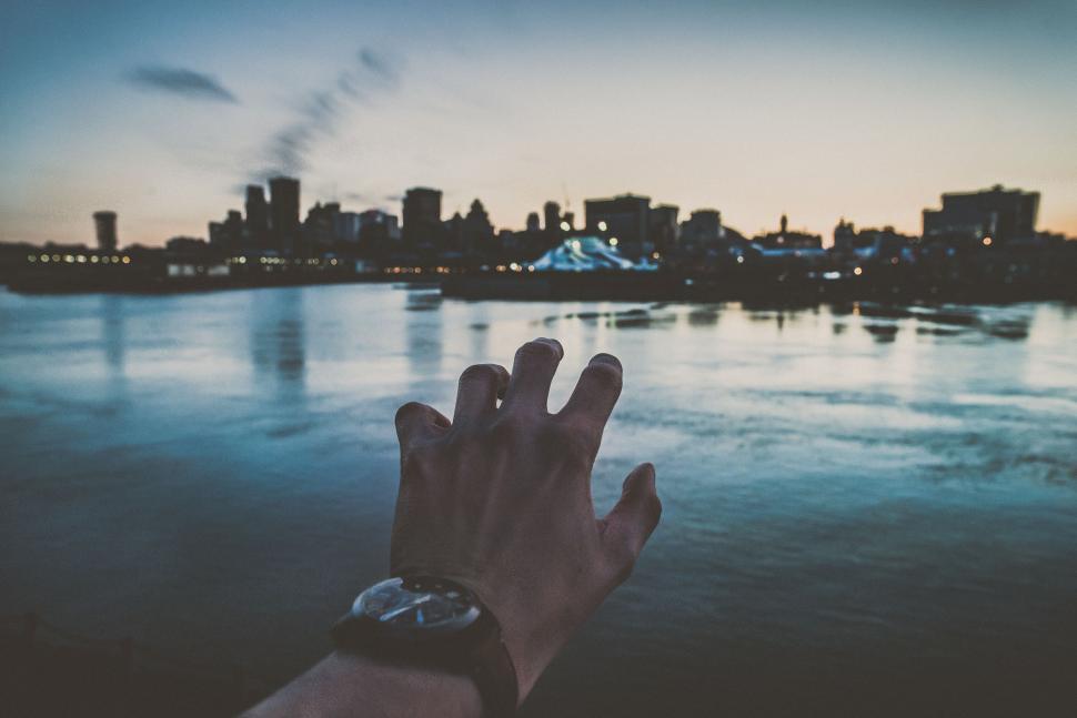 Free Image of Hand Reaching Over Waters Edge 