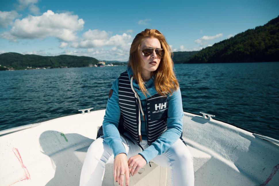 Free Image of Woman Sitting in Boat on Lake 