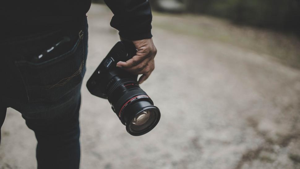 Free Image of Person Holding Camera in Black and White 