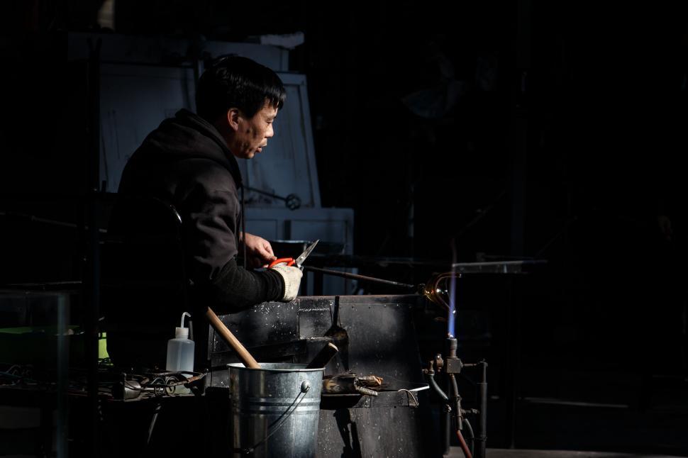 Free Image of Man Cooking in Black Jacket 