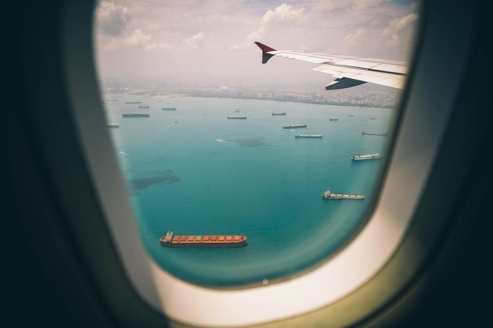 Free Image of A View of the Ocean From an Airplane Window 