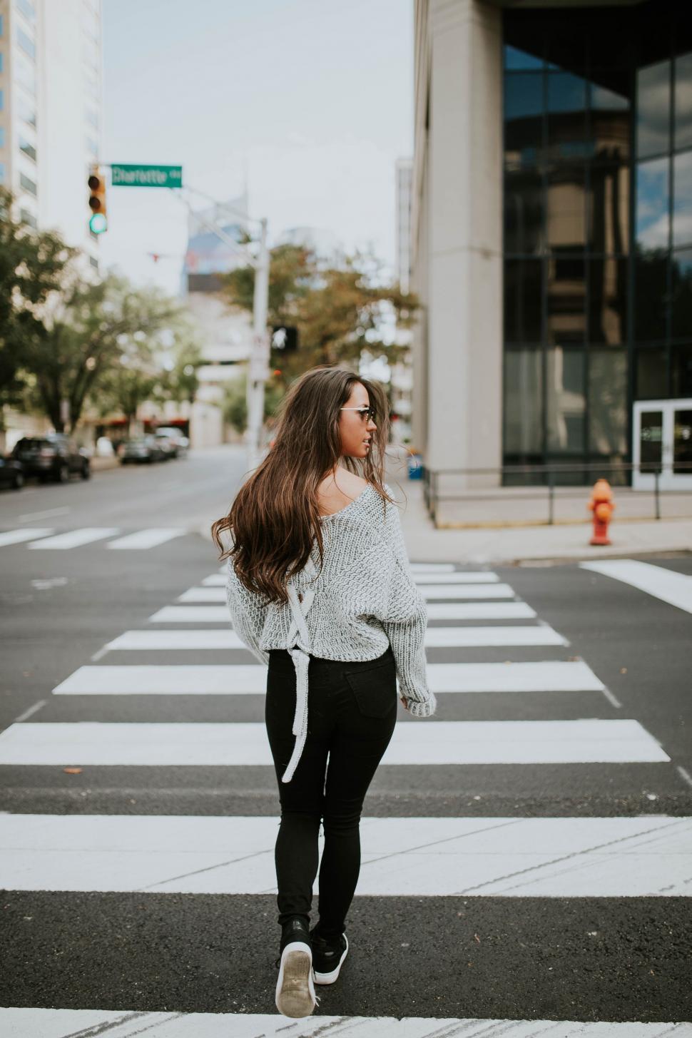 Free Image of Woman Crossing Street in Crosswalk 