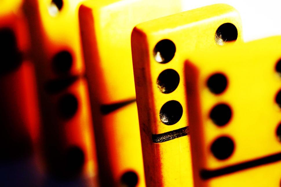 Free Image of Row of Yellow Dominoes Stacked Together 