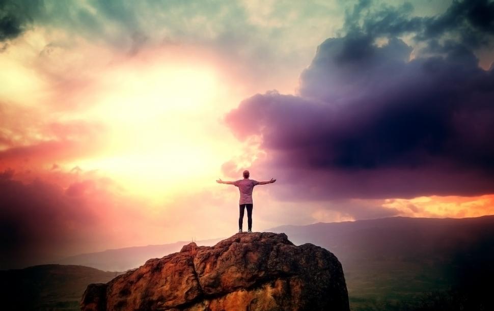Free Image of Man on the Summit Embracing a Brave New Day 