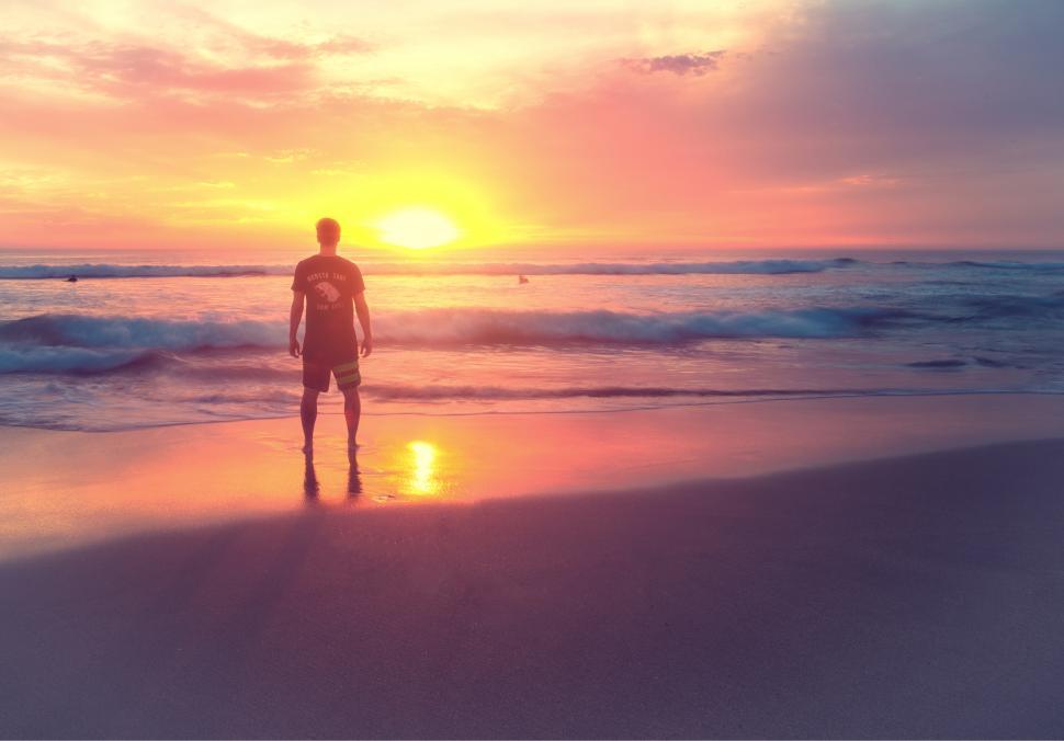 Free Image of Young Man at Sunset on the Beach 