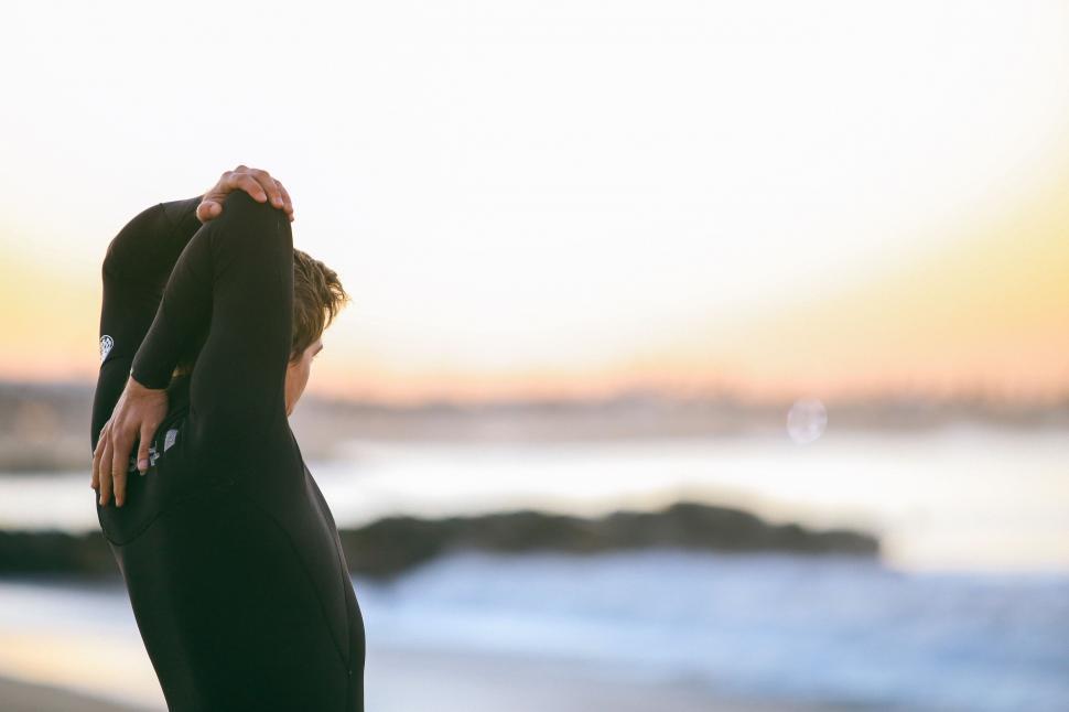 Free Image of Man and Woman Standing on Beach 