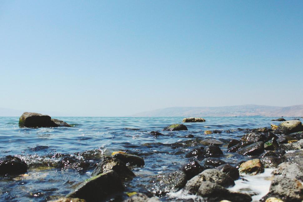 Free Image of Rocky Shoreline Scene With Water 