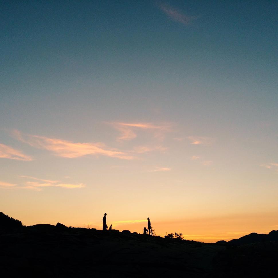 Free Image of Couple Standing on Top of Hill 