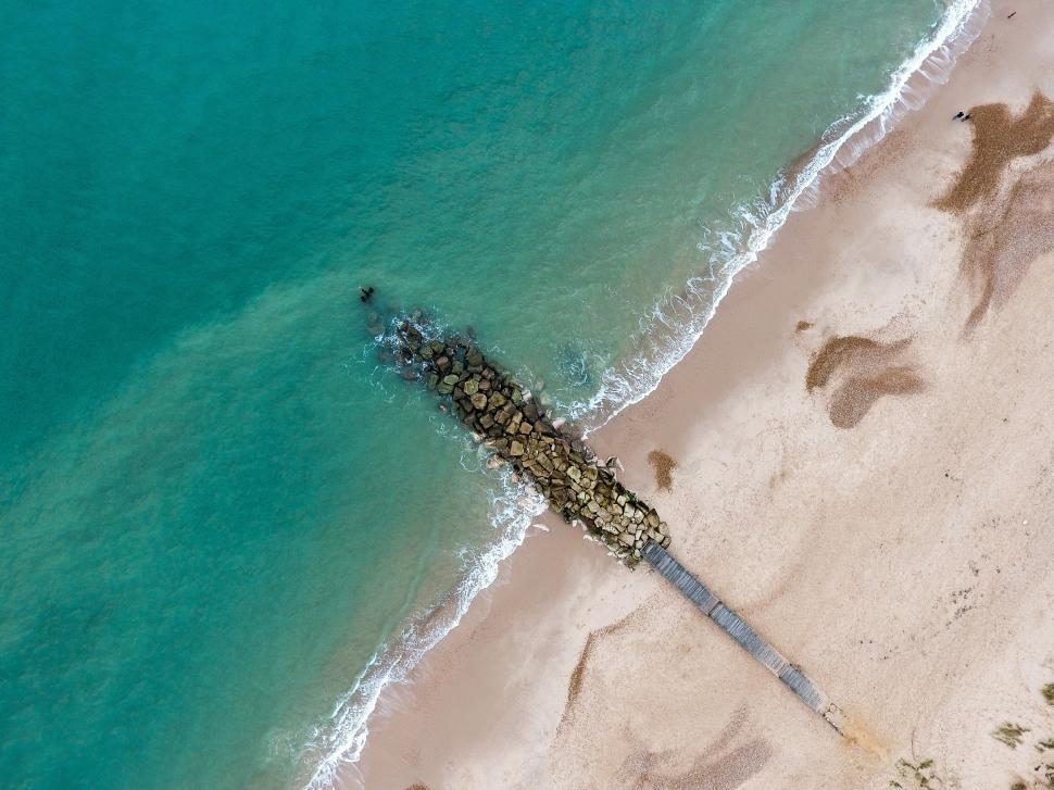 Free Image of Boat Docked on Sandy Beach 