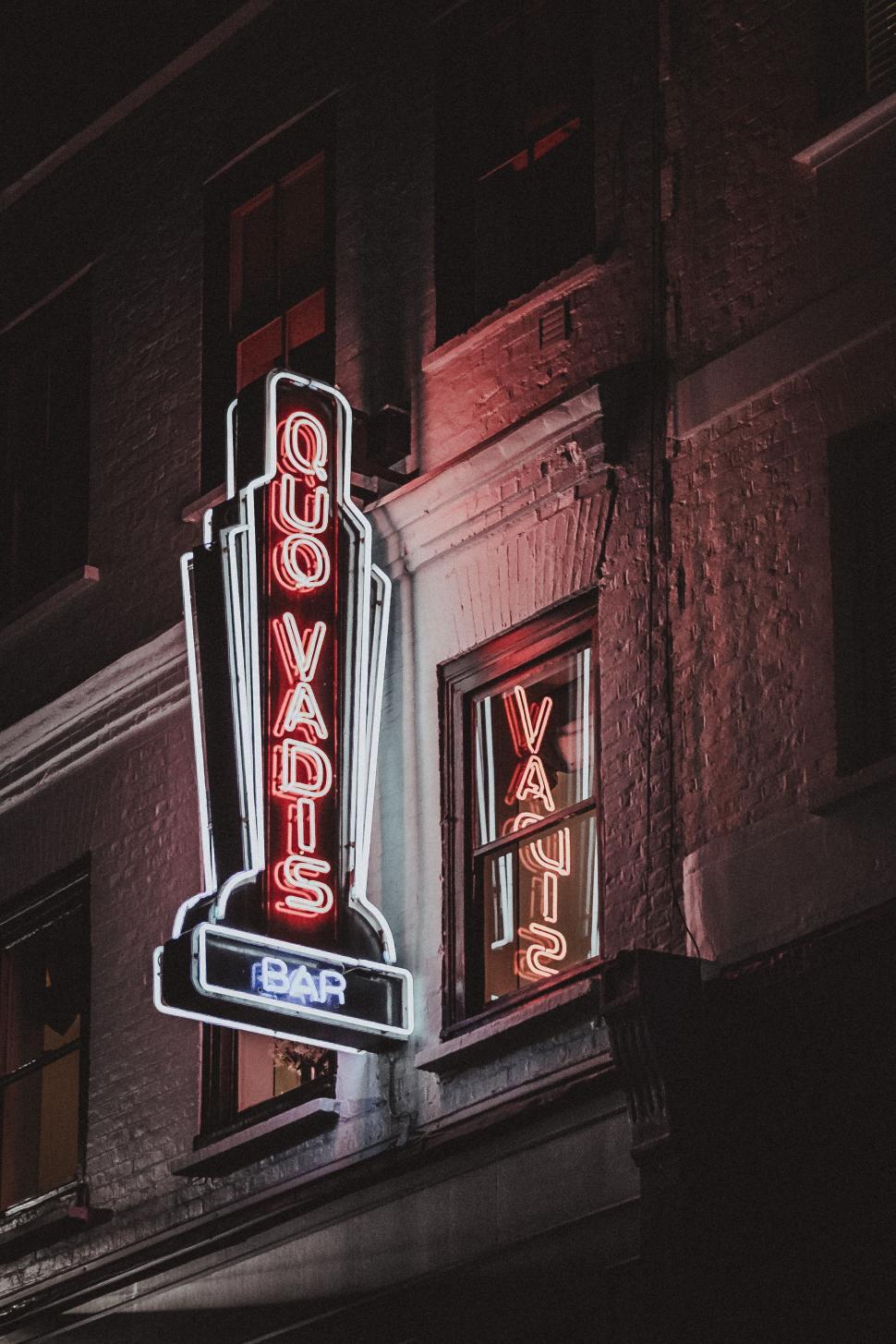 Free Image of Neon Sign Illuminating Building Facade 