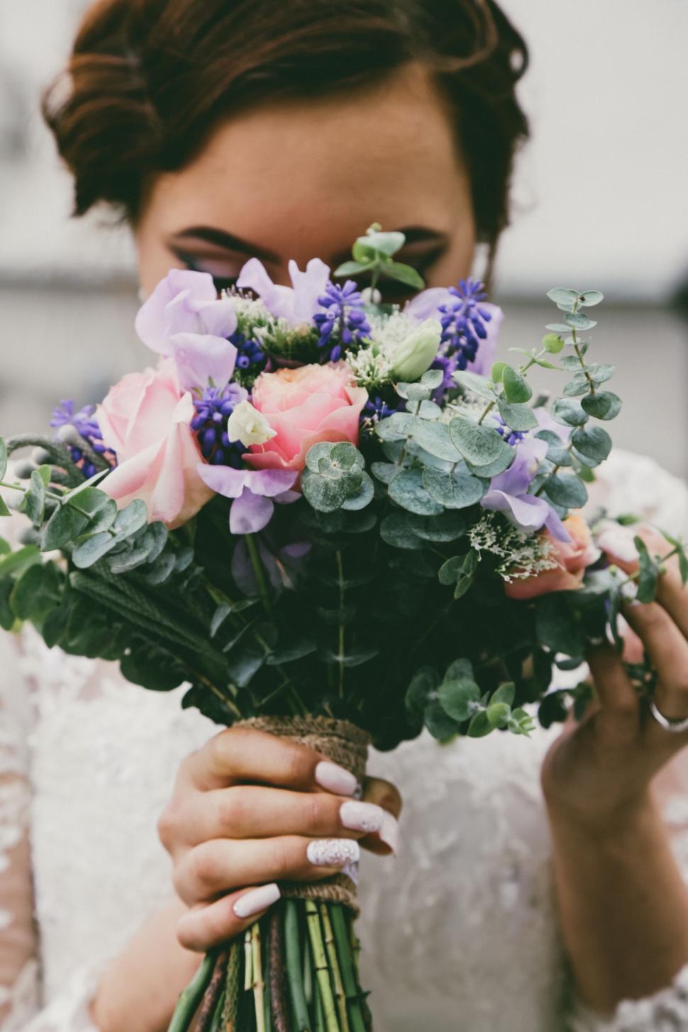 Free Image of Woman Holding Bouquet of Flowers 