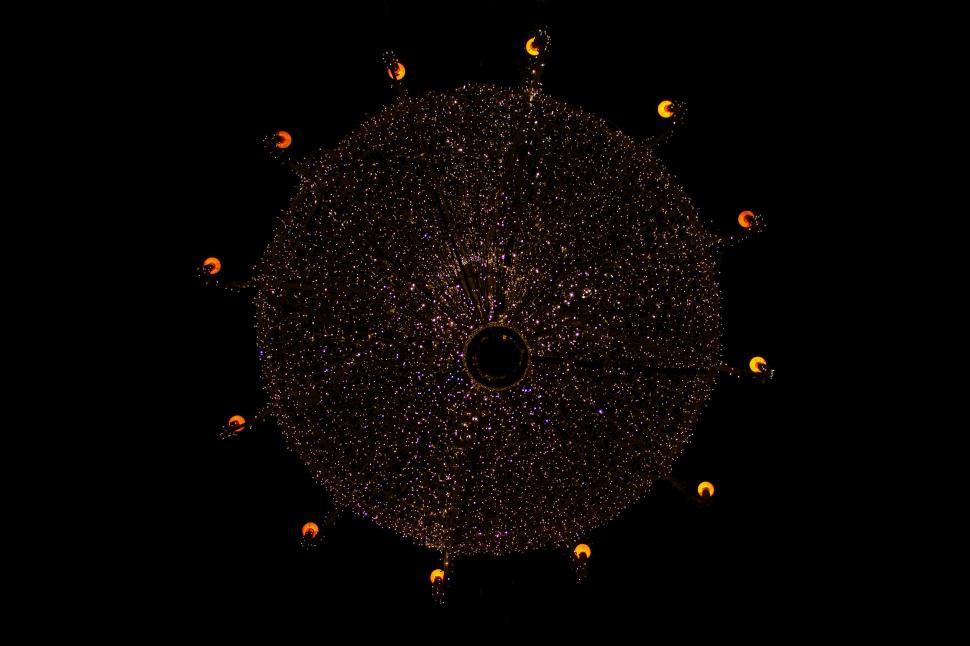 Free Image of Black Circle Surrounded by Small Yellow Dots 