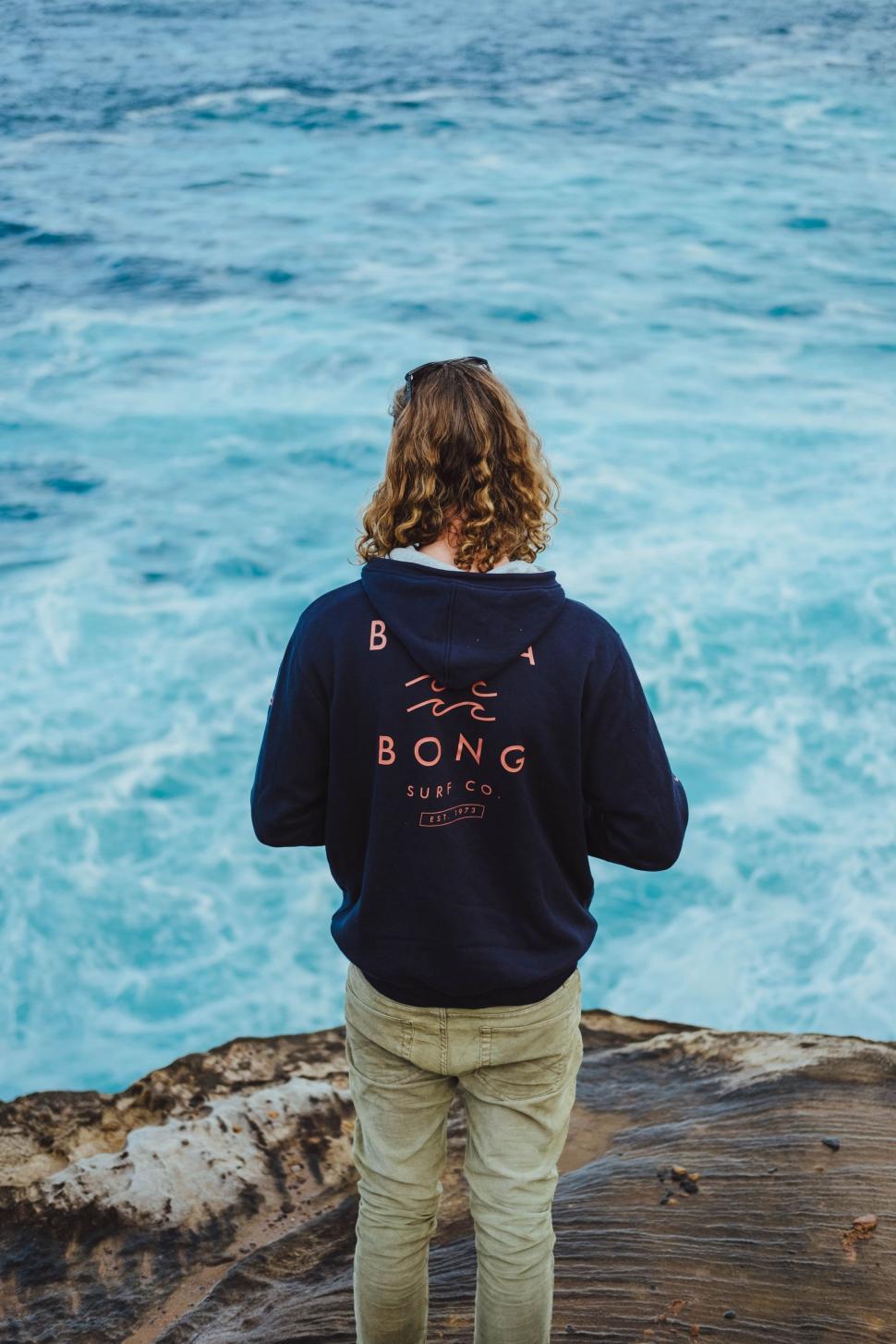 Free Image of Person Standing on Pier Looking at Ocean 