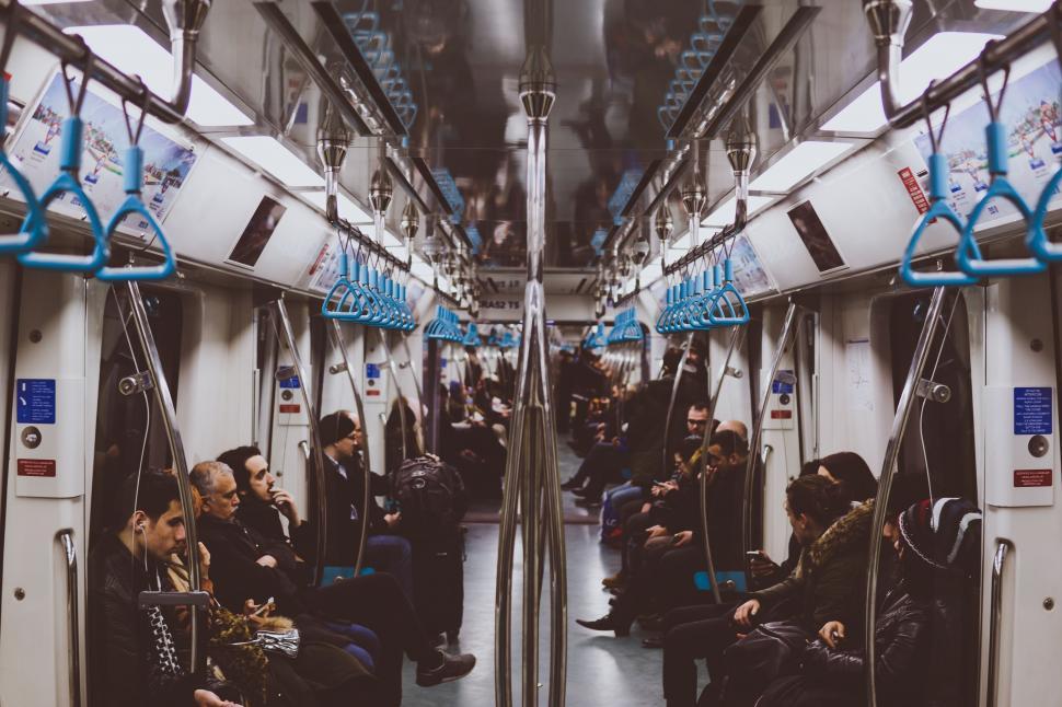 Free Image of Group of People Sitting on a Train 
