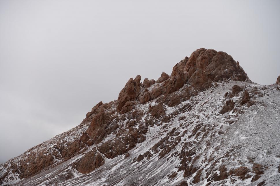 Free Image of Snowboarder Descending Snowy Mountain 