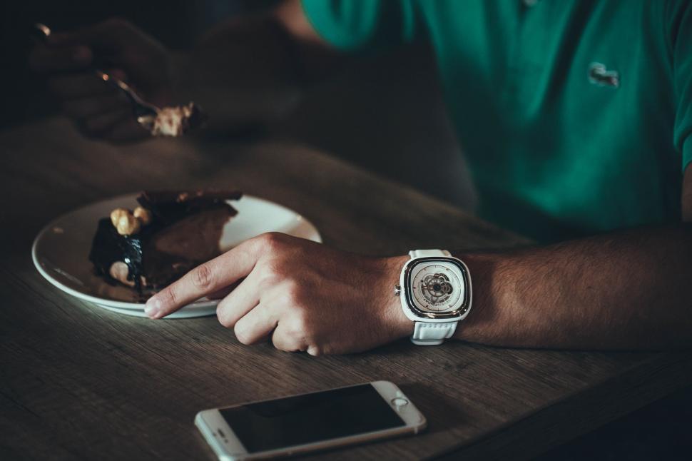 Free Image of Man Sitting at Table With Plate of Food 