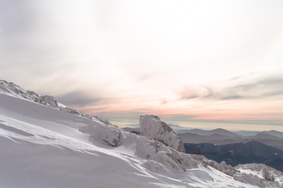Free Image of Man Skiing Down Snow Covered Slope 