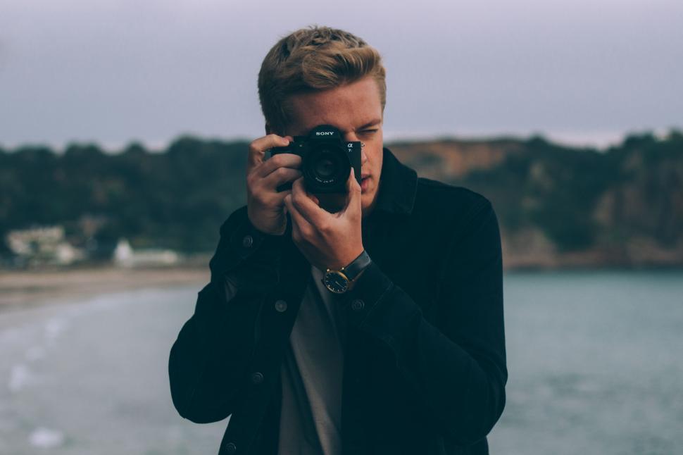 Free Image of Man Taking a Selfie With a Camera 