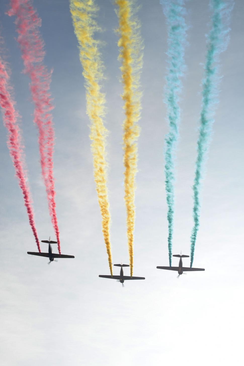 Free Image of Group of Airplanes Flying Through Blue Sky 