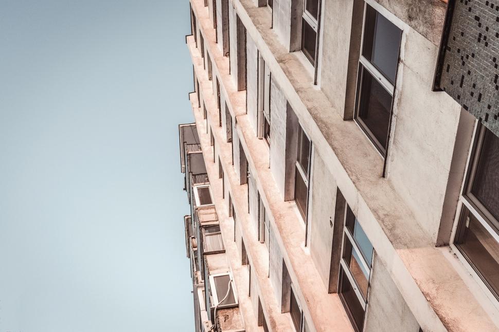 Free Image of Towering Building With Many Windows and Balconies 