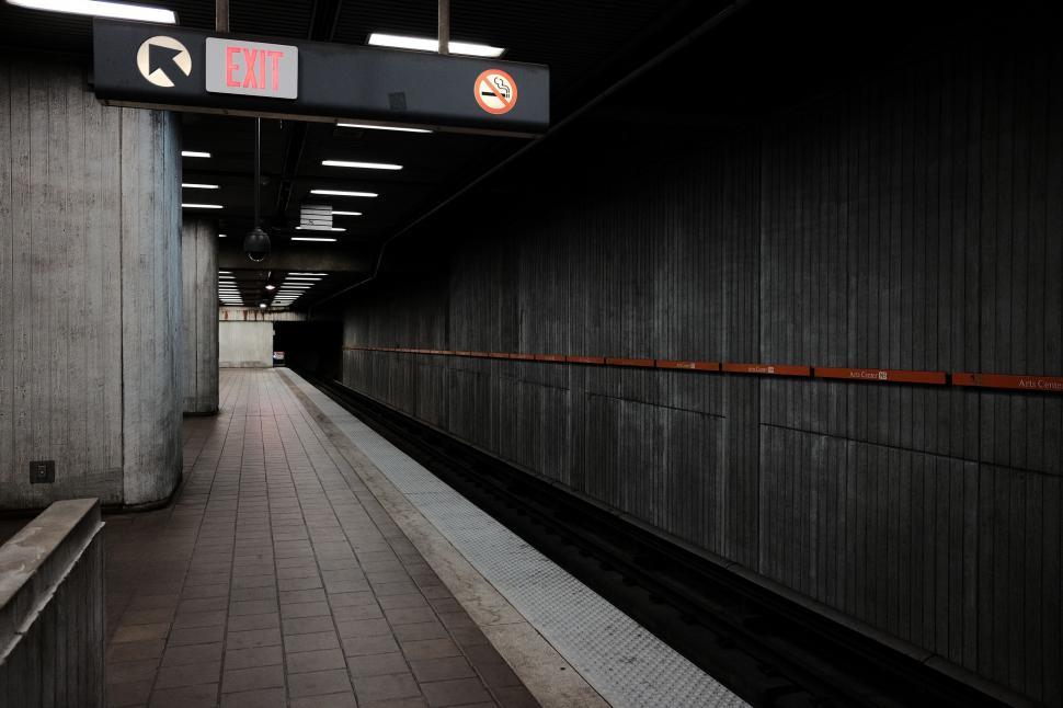 Free Image of Subway Station With Sign Above Platform 