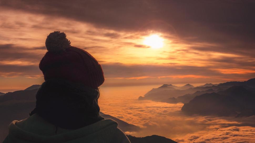 Free Image of Person Standing on Top of Snow-Covered Mountain 