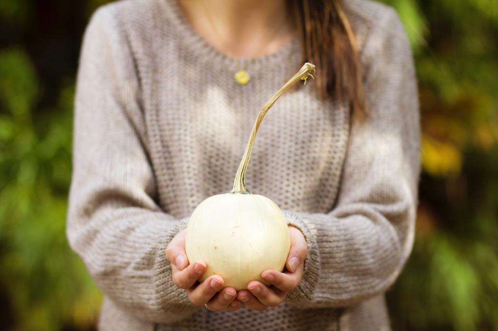 Free Image of Woman Holding an Apple in Her Hands 