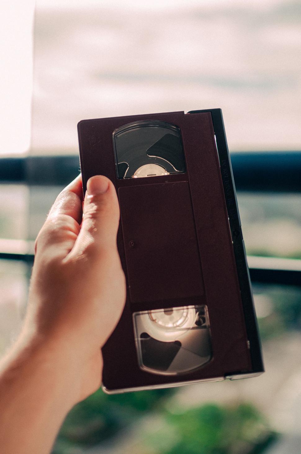 Free Image of Person Holding a DVD 