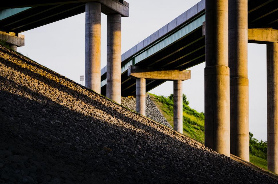 Free Image of Bridge Crossing Over Dirt Hill 