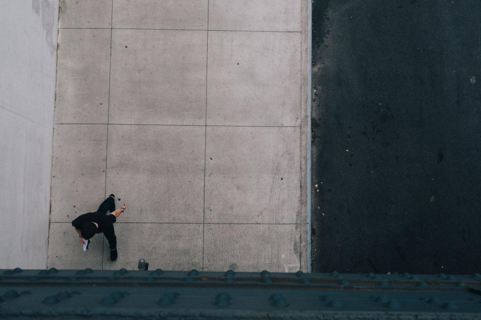 Free Image of Person Leaning Against Wall 