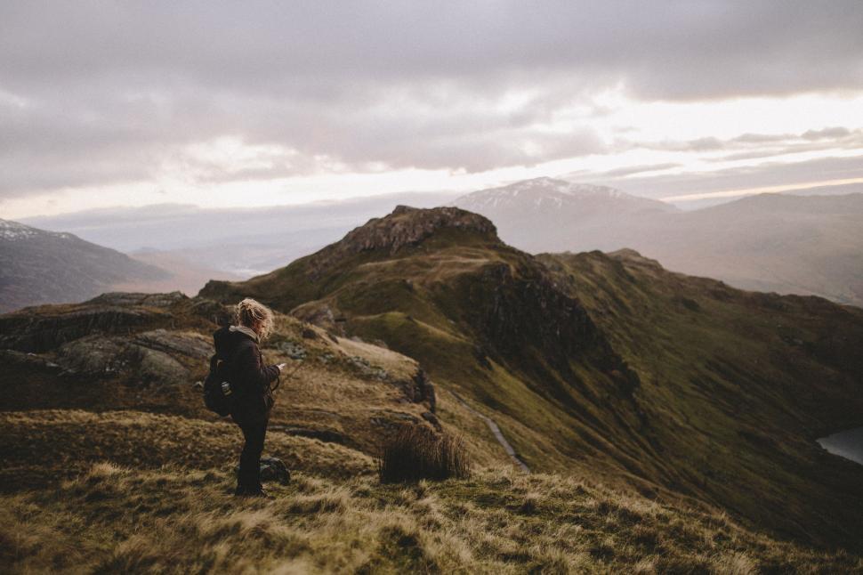 Free Image of Person Standing on Top of a Mountain 