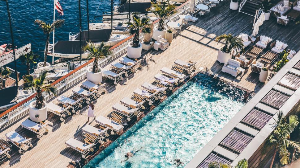 Free Image of Aerial View of Pool, Lounge Chairs, and Dock 