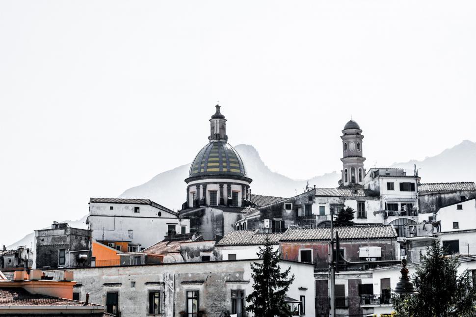 Free Image of Cityscape With Mountains in Background 