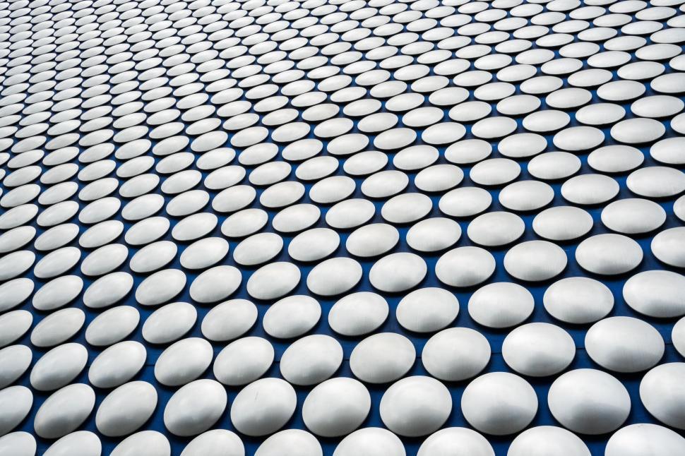 Free Image of Building Covered in White Circles 
