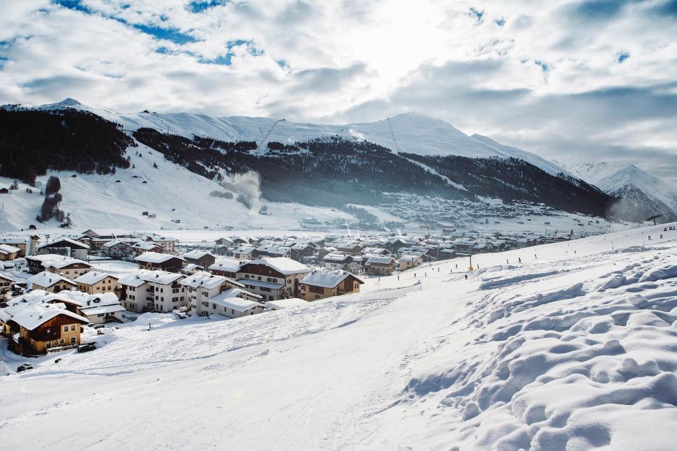 Free Image of Man Skiing Down Snow Covered Slope 