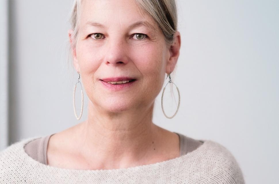 Free Image of Woman With Grey Hair Wearing Large Silver Hoop Earrings 