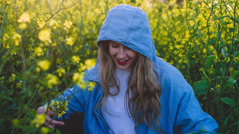 Free Image of Woman in Blue Jacket in Field of Flowers 