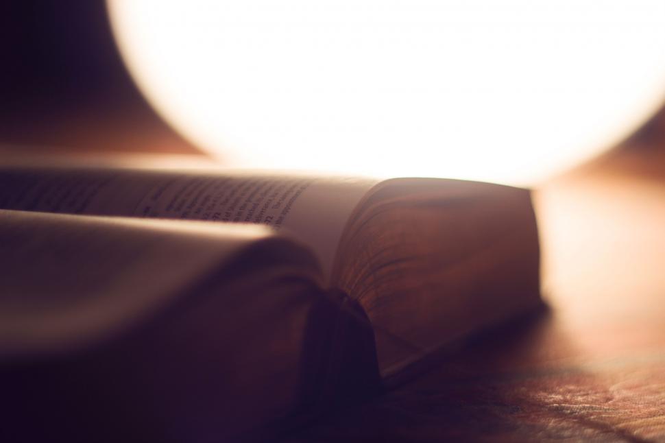 Free Image of Close Up of an Open Book on a Table 